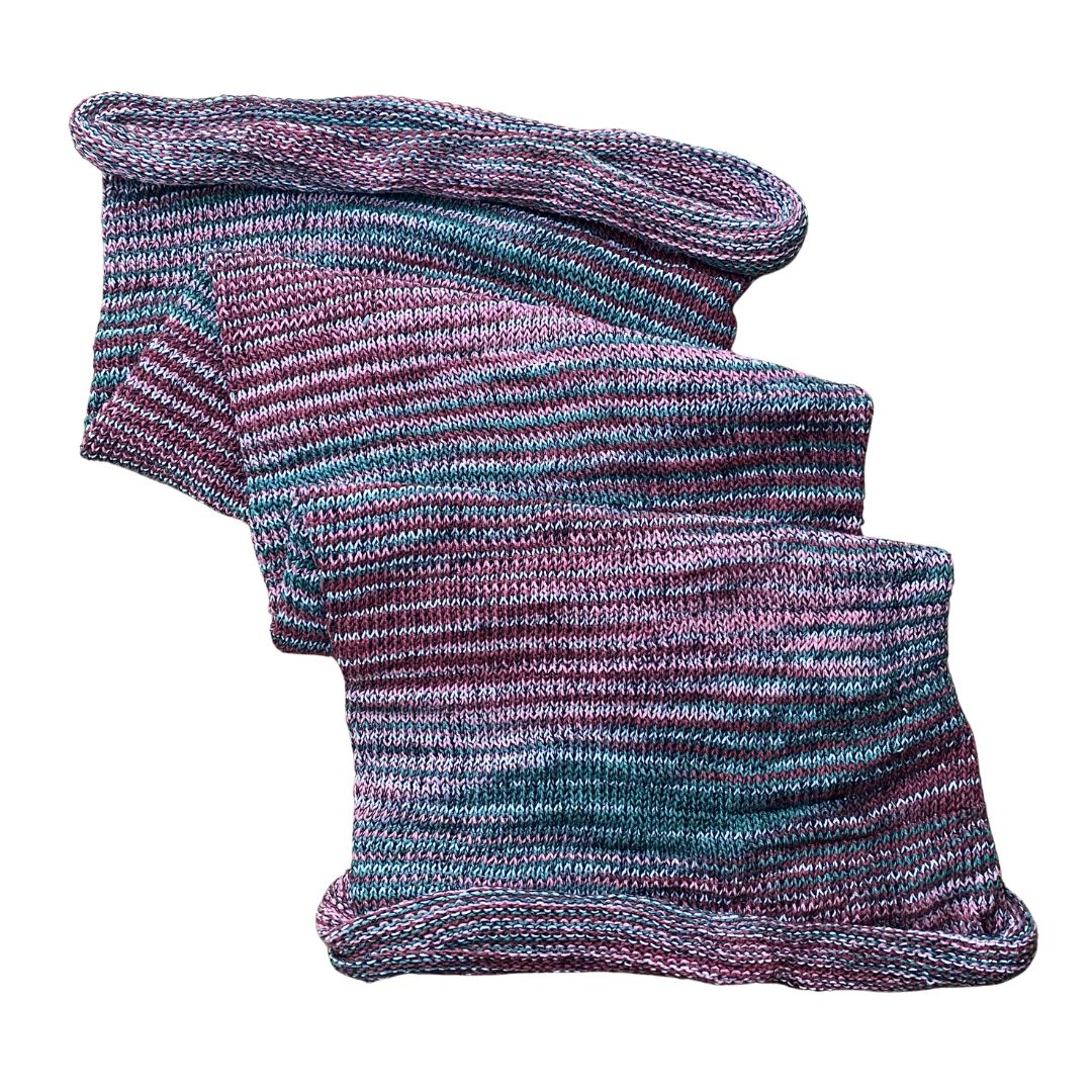 Light purple and green large cotton dreadlock sock on a white background.