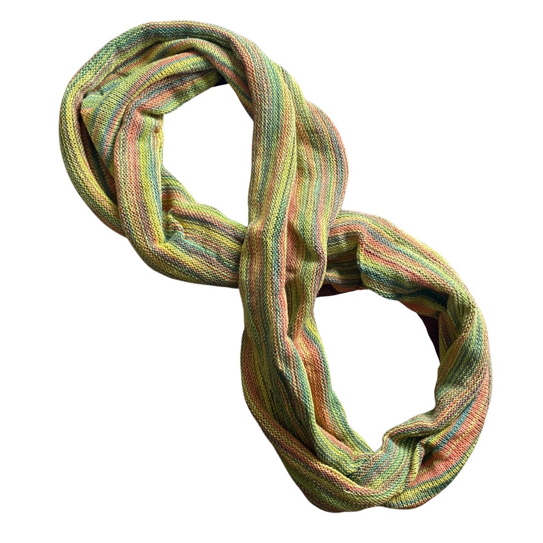 Light red, yellow, green cotton double loop dread wrap headband on a white background.
