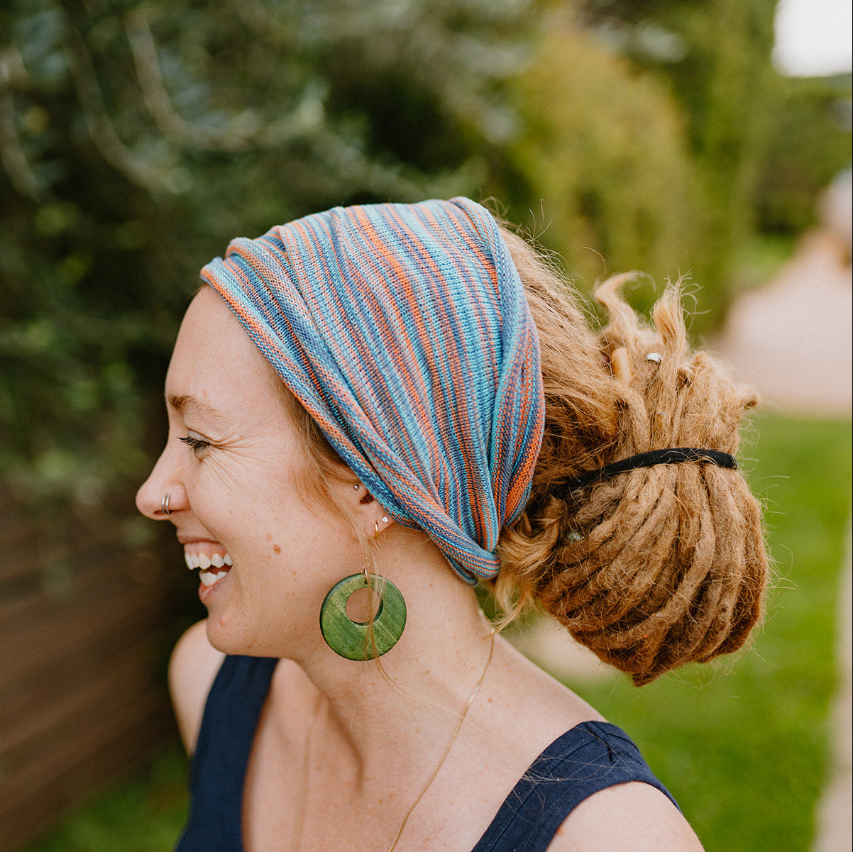 Lady wearing a double loop cotton wrap in a natural setting