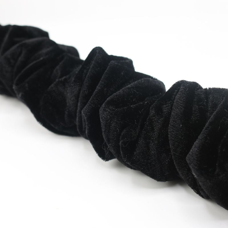 Black spiralock wire dread tie scrunchies on a white background