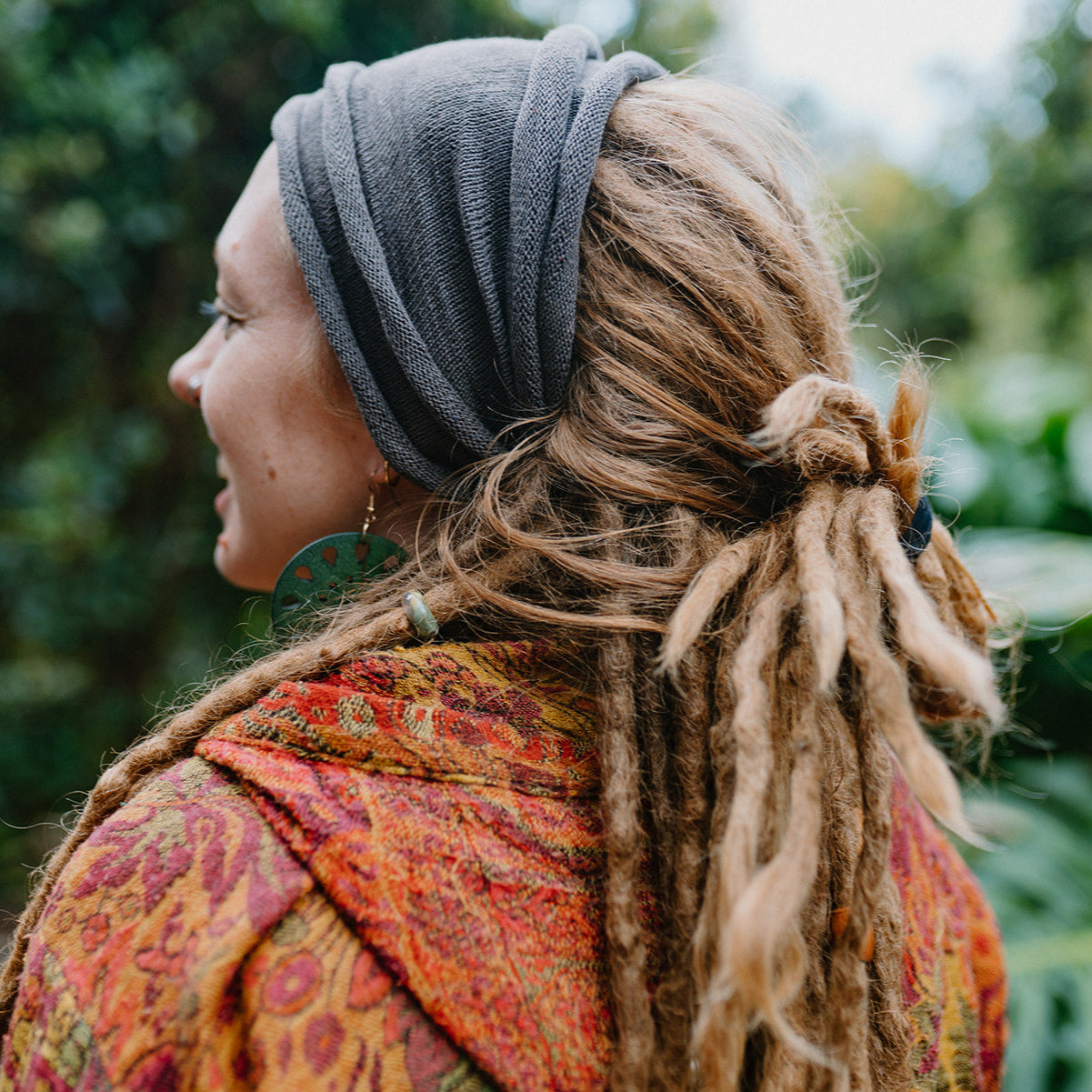 Lady with double loop cotton headband in a natural setting.