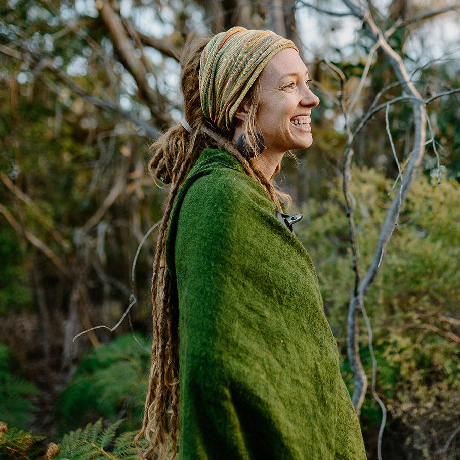 Lady wearing a double loop cotton hair loop with a poncho on