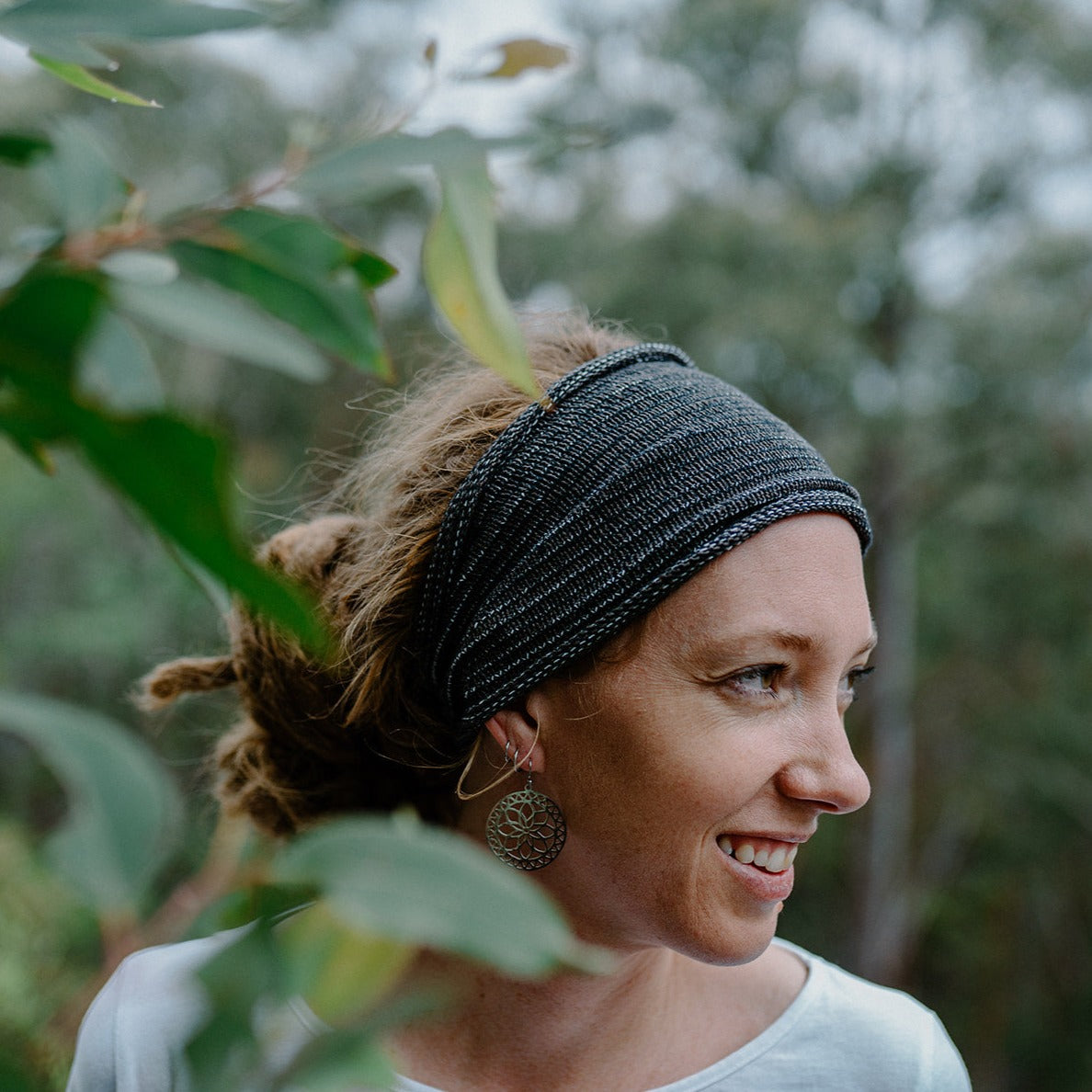 Woman with dreadlocks wearing a cotton headband outdoors