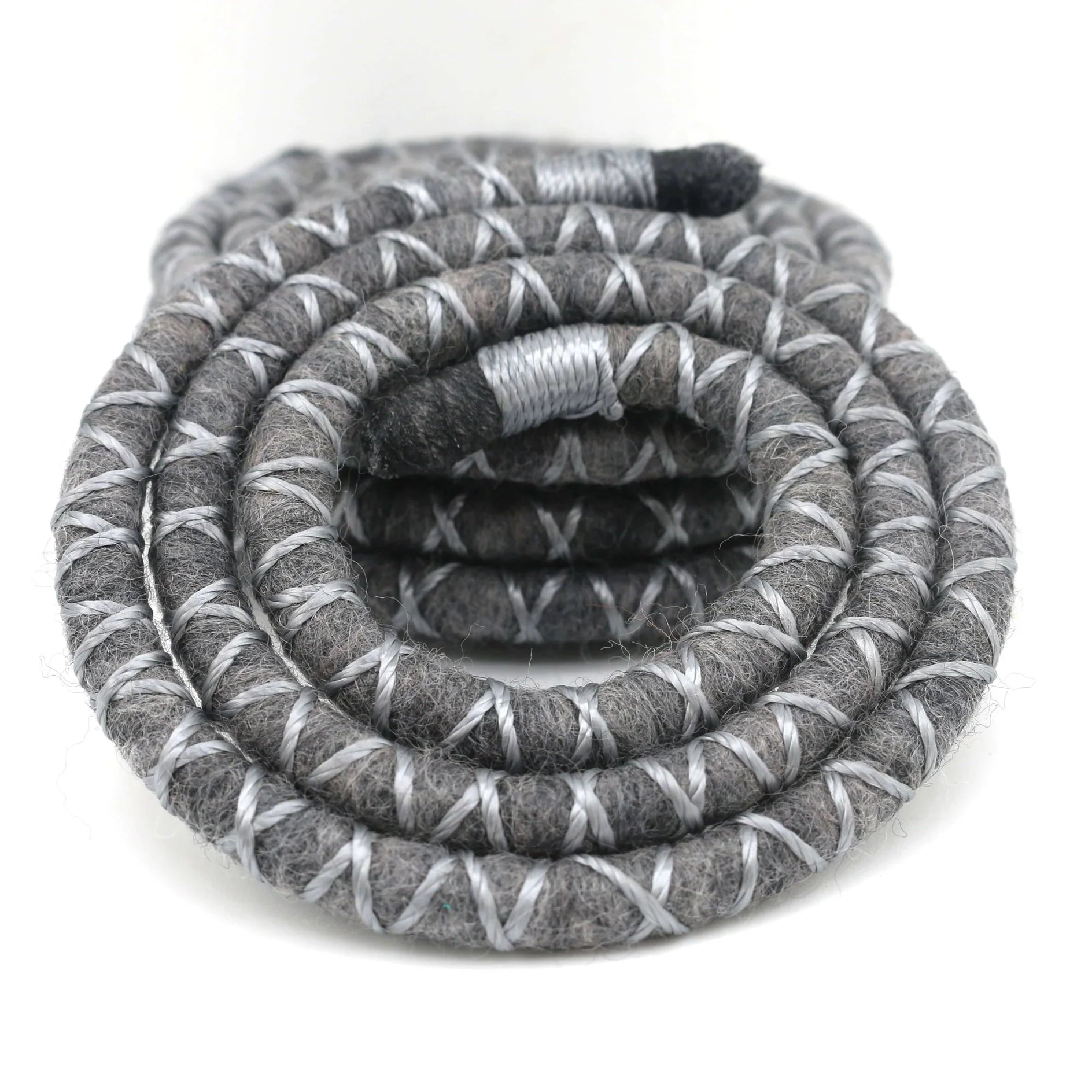 Grey dreadlock spiralock hair tie on a white background