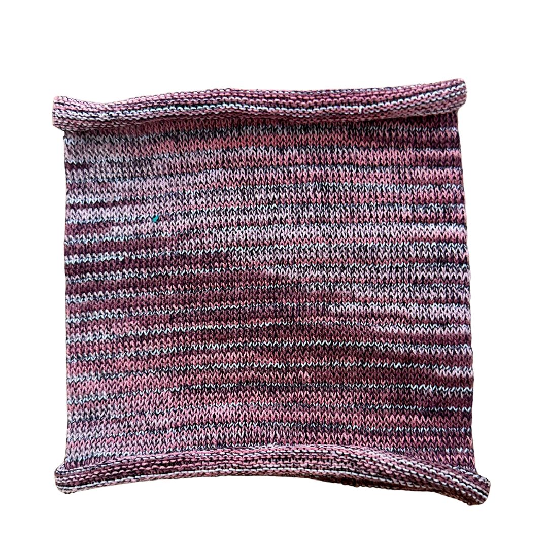 Pink toned cotton headband on a white background