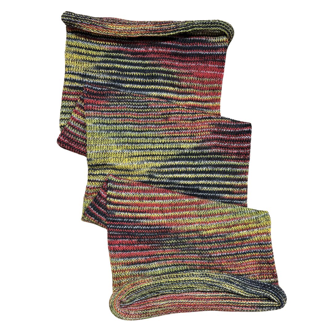 Black red yellow large cotton dreadlock sock on a white background.
