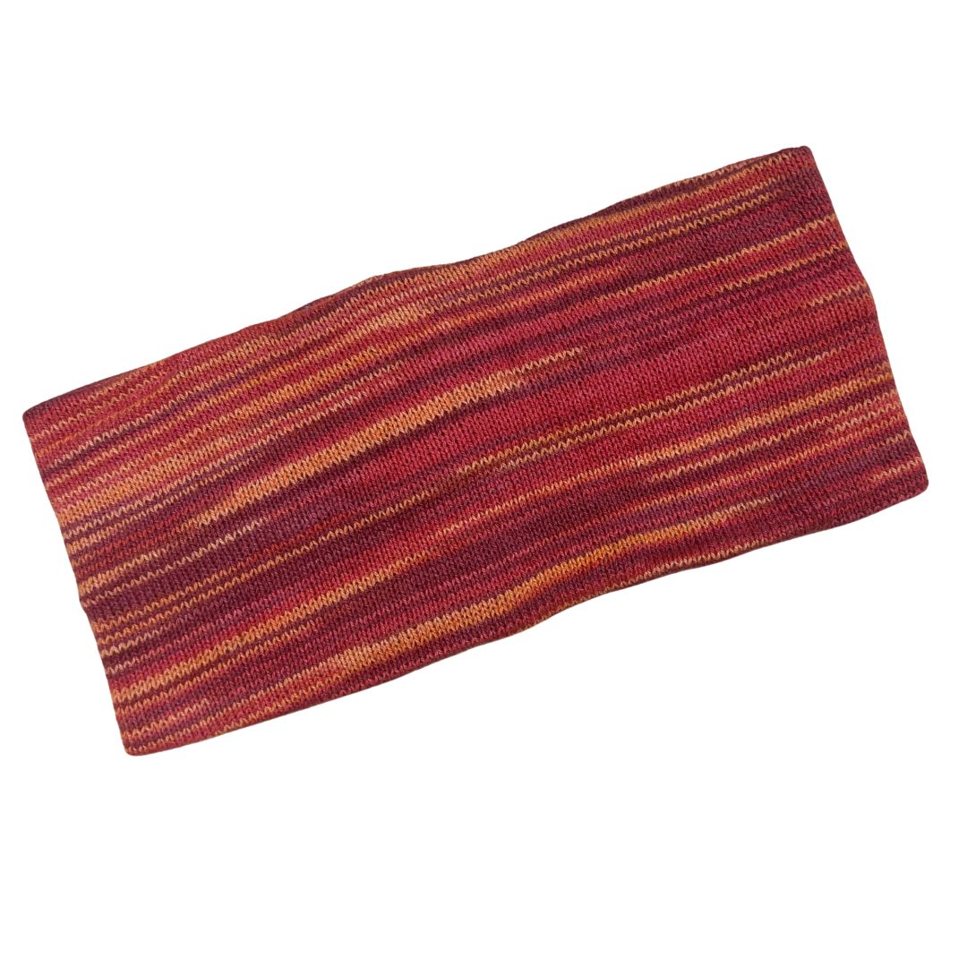 Knitted headband with red and orange stripes on a white background