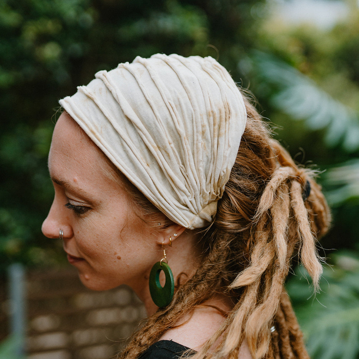 White/brown cotton tie-up hair cotton headband on a lady in a natural setting
