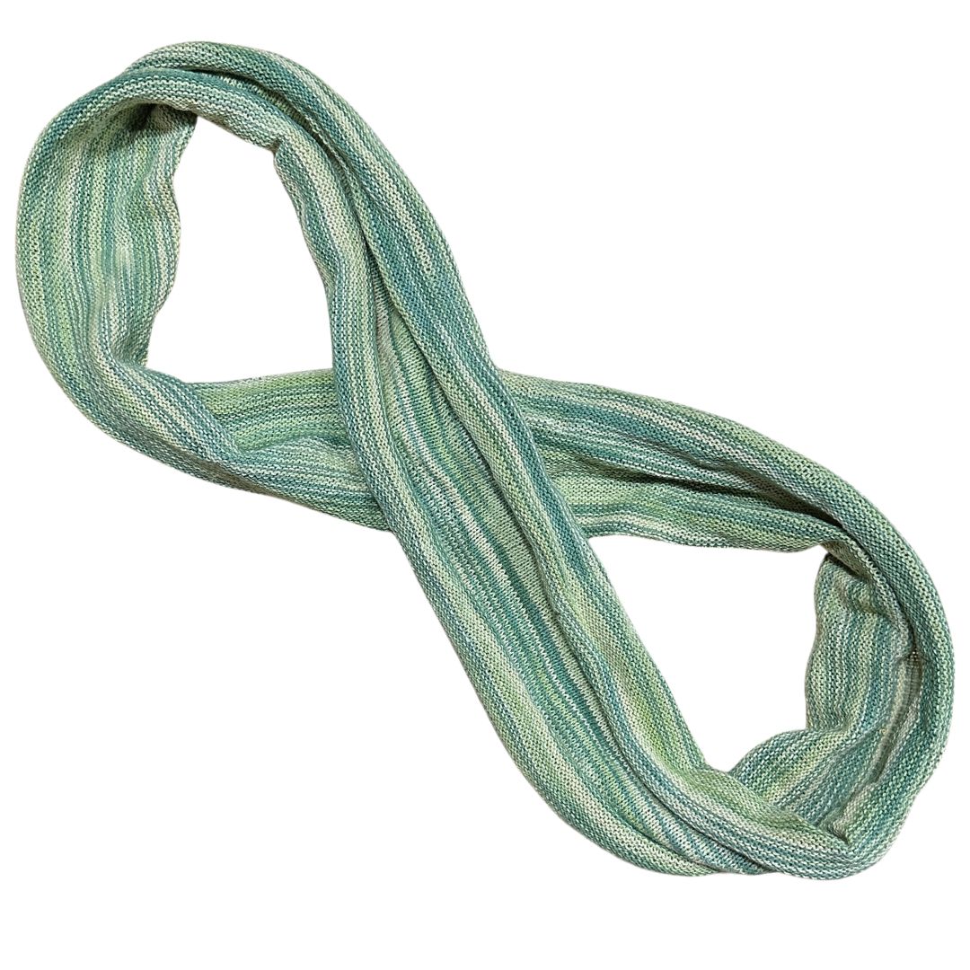 Green and white cotton double loop dread wrap headband on a white background.
