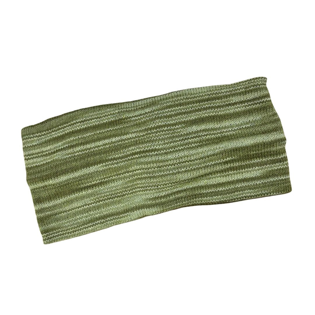 Green knitted headband on a white background