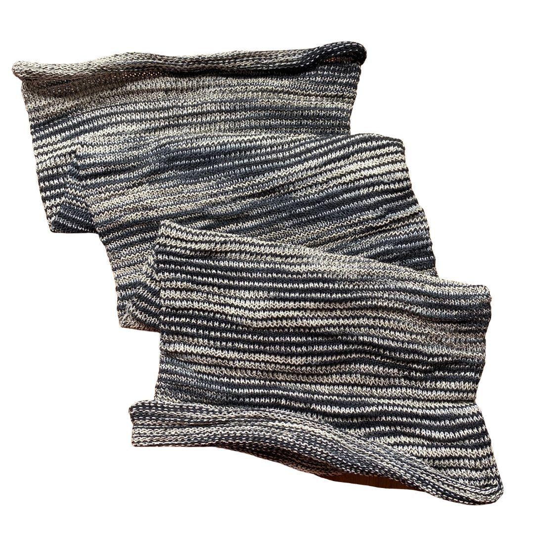 Grey/black large cotton dreadlock sock on a white background.