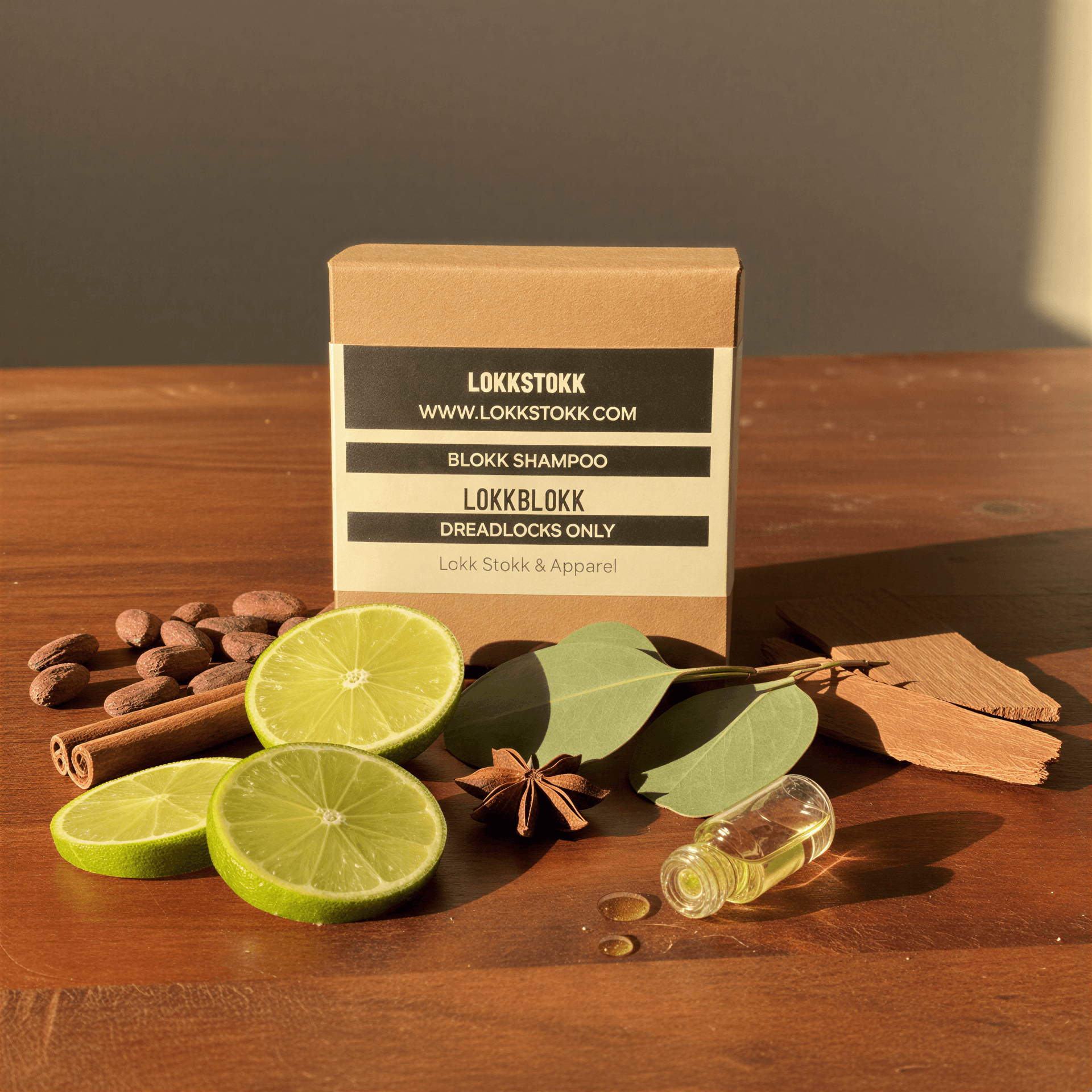 Shampoo-bar-box-lokkstokk lokkblokk on a wooden bench surrounded by ingredients.