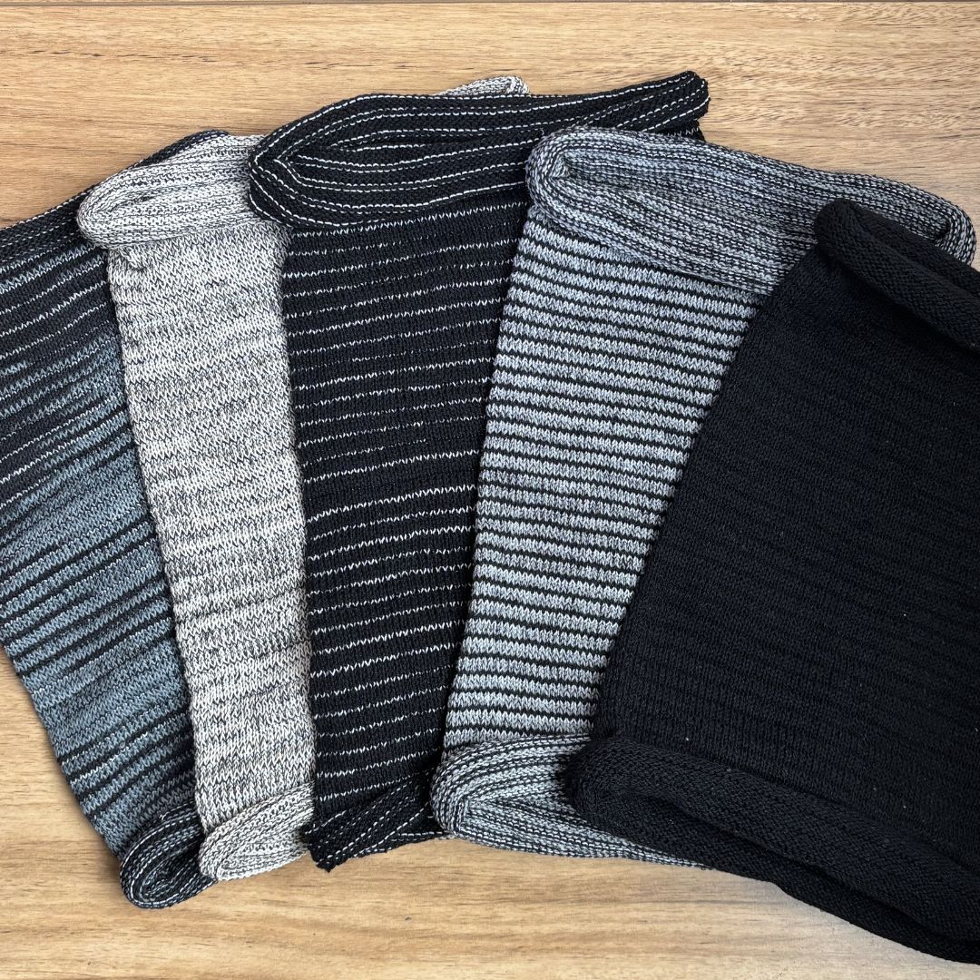 Black White and grey Headbands on a wooden background.